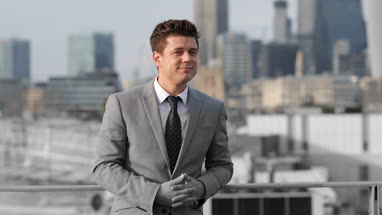 Portrait of businessman with London city skyline