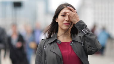 Portrait of businesswoman on busy street