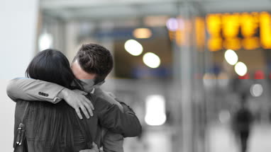 Couple meeting at a station