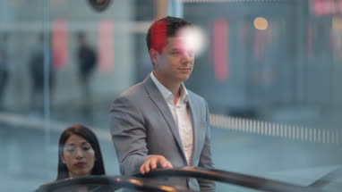 Commuters travelling on escalator