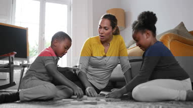 Mum with Kids building a tower