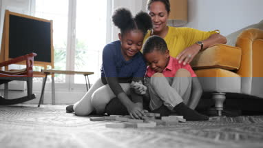Mum with Kids building a tower