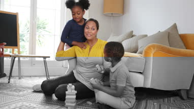 Mum with Kids building a tower