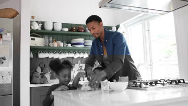 Brother and sister playing at breakfast time 