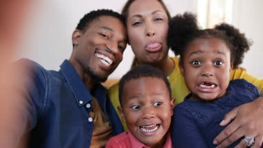 Family taking a selfie with a smartphone