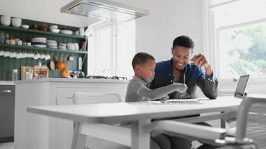 Father helping Son with school work