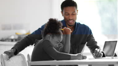 Children learning how to write alphabet