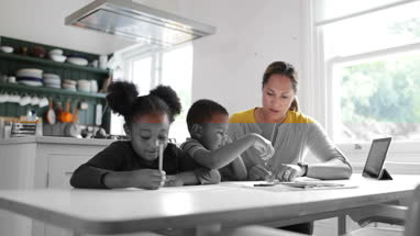 Children learning how to write alphabet