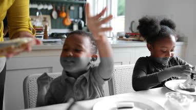 Mother making lunch for kids