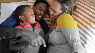 Family tickling each other