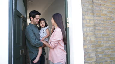 Father with Daughter waving goodbye to Mother