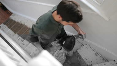 Father helping Daughter walk up stairs