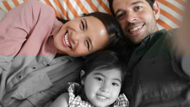 Family taking a selfie with a smartphone