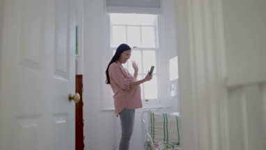 Pregnant woman taking selfie with smartphone