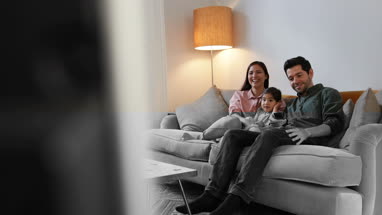 Family watching TV together