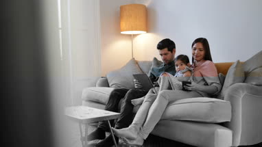 Family using technology devices