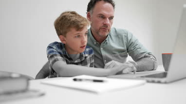 Father helping son with homework