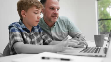Father helping son with homework