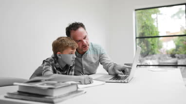 Father helping son with homework