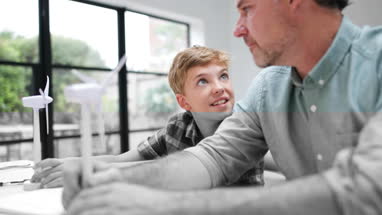 Father helping son with school project
