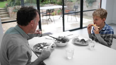 Father having pizza with his Son