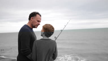 Father and Son fishing in the sea
