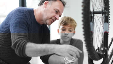 Father teaching Son how to decorate