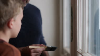 Father teaching Son how to decorate