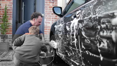 Father and Son washing a car together