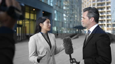 News presenter interviewing on the street