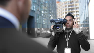 TV presenter being counted in by cameraman