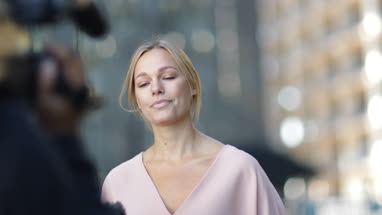 News presenter reporting to camera