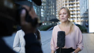 News presenter interviewing on the street