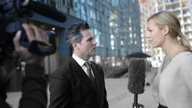 News presenter interviewing live on the street