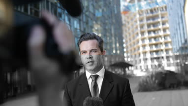 TV presenter talking to camera