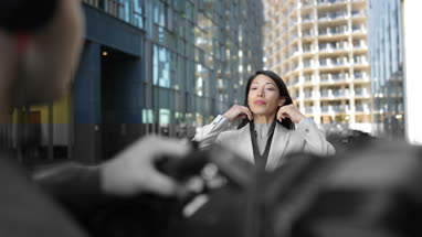 TV presenter having make-up applied on location