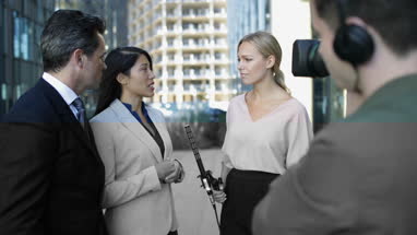 Media group interview being recorded for broadcast