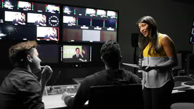 TV crew having meeting in control room
