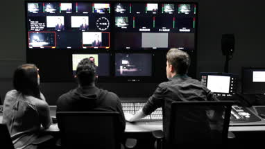 Operators in a control room at a television studio