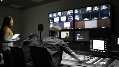 Operators in a control room at a television studio
