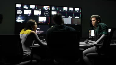 TV crew having meeting in control room