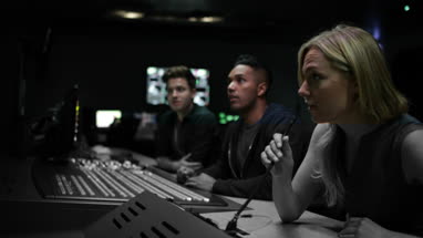 Operators in a control room at a television studio