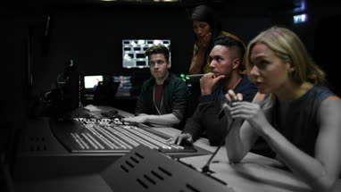 Operators in a control room at a television studio