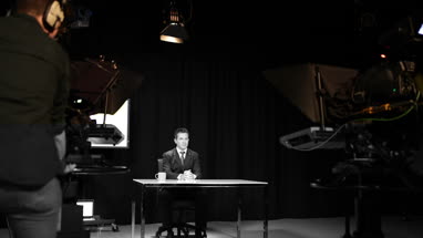 News presenter in a TV broadcasting studio