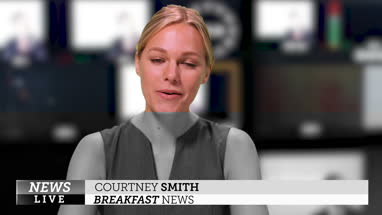 News presenter reading the breakfast news