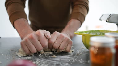 Close-up of man making pasta dough