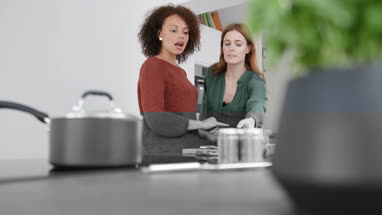 Adult female picking chilli for her recipe