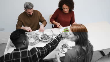 High angle friends enjoying a meal together