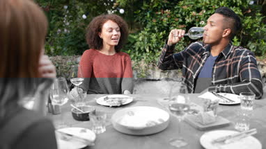 Friends eating a meal outdoors