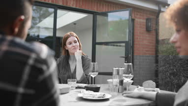 Friends eating a meal outdoors